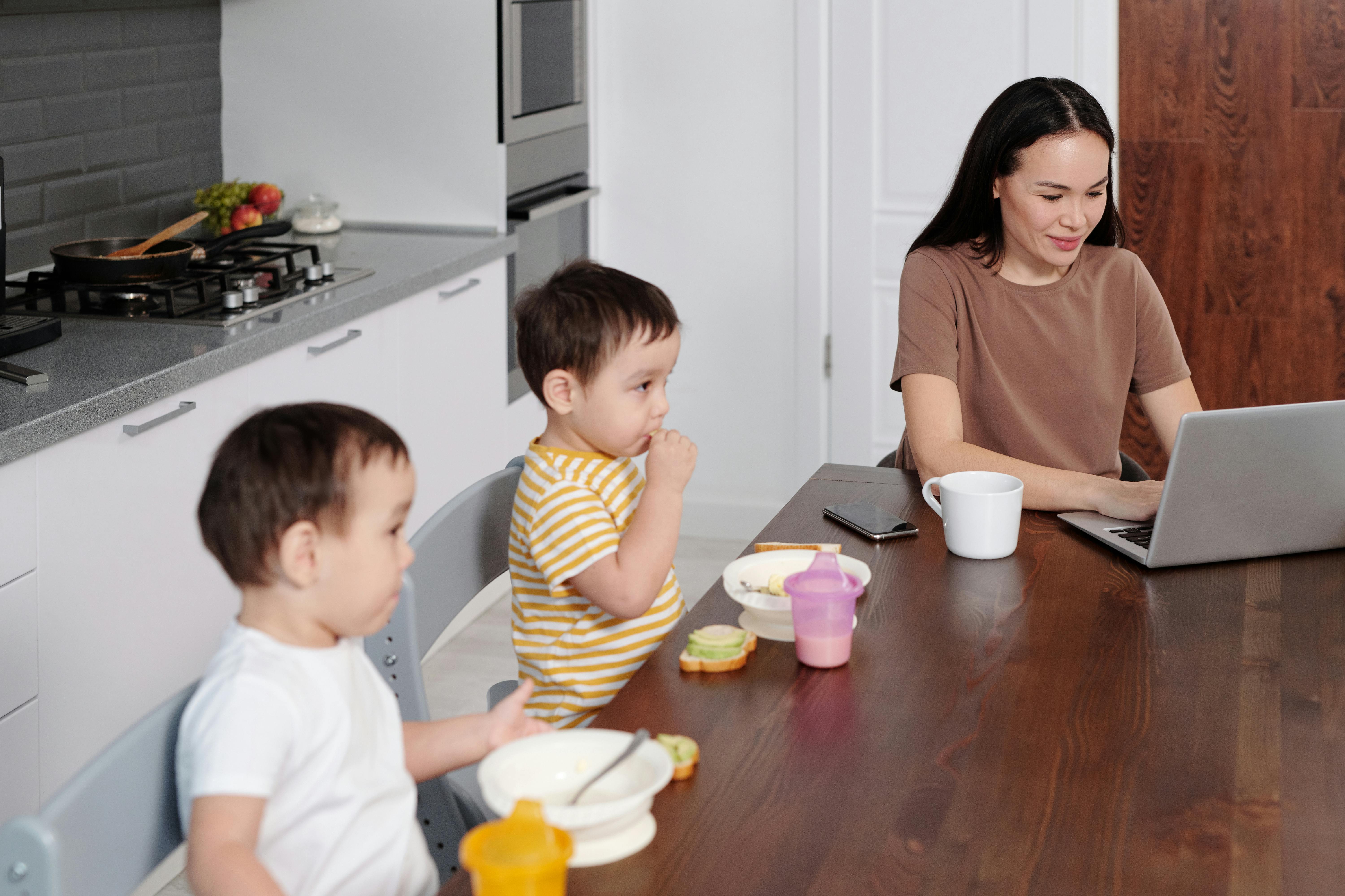 Mom entrepreneur working from home with kids
